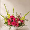 Lush, abundant, and unmistakably celebratory, this arrangement is designed in vivid pinks