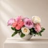 A soft and romantic arrangement in blush, petal pink, and creamy white