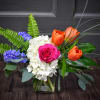 Bright, garden-fresh color greets the recipient with a lively mix of pink