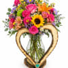 A lovely wood-colored vase adorned with a wooden heart, filled with classic