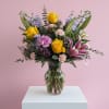 A bright mix of sunny yellow roses, fragrant pink lilies, and soft