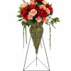 A beautifully crafted standing spray featuring high-quality silk flowers arranged in a