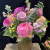 Pink and lavender bouquet in a ribbed glass vase
