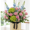Revel in the freshness of our floral arrangement featuring green hydrangeas, pink