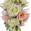 Bouquet of white and blush roses with pink ribbon accents