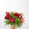 Bouquet of red and pink flowers in a glass vase