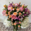 Mixed colors of mixed flowers, beautifully arranged is a chic clear vase!