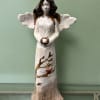 This beautiful angel is 17 inches tall and features a beautiful redbird