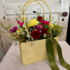 A 'handbag" full of fresh picked beauty. Designed with fresh seasonal blooms