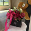 Fresh blooms in a chic floral bag- elegant, unique, and ready to