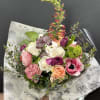 Designers Choice of Seasonal Flowers wrapped in specialty paper with coordinating ribbon