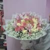 The Pink Dreamscape arrangement features a stunning collection of soft pink lilies