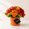 Orange and red rose bouquet in an orange vase