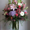 A lavish, garden-style bouquet that reads as celebration: this flower arrangement makes