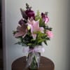 A sweet arrangement in soft pinks and delicate pastels, thoughtfully designed to