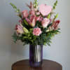 Mix of season flowers with lush florals which may include roses, gerbera