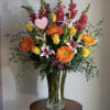 A lush, abundant Mother&rsquo;s Day arrangement designed to celebrate her love in