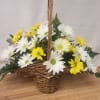 Princess style basket with white and yellow daisies that say it all.