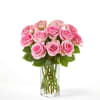Pink roses arranged in a clear glass vase