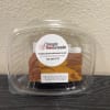 Plastic clamshell container holding milk chocolate peanut butter swirl fudge