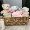 Welcome the newest little baby girl home with a gift basket bursting