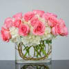 premium pink roses floating on a cloud of white hydrangea  

*picture