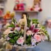 Basket of pink and white flowers with green button mums