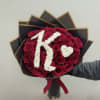 30 long stem roses wrapped in korean paper and initial added 
