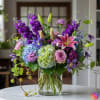 A bold, gorgeous composition in an elevated palette of pinks, purple and