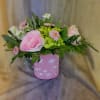 A lush blend of pinks and fresh spring greens gathered in a