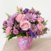 Sweet, delicate, and full of charm, this arrangement is the perfect way