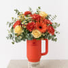 Bright, cheerful, and full of warmth, this stunning arrangement is designed in