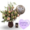Peach roses and pink alstroemeria take center stage in this Mother's Day