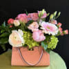 Where florals meet fashion! Lush pink and blush blooms overflow from an