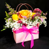 Surprise your mom with this beautiful tote inspired arrangement with gorgeous flowers