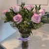 Brighten up someone's day with beautiful lavender roses! Contains one dozen long