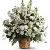 White floral arrangement in a woven basket