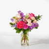 These blooming pink roses, purple stock, and lavender carnations will have your