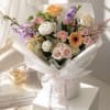 Soft pastels of pink, white, lavender and peach create a tender, romantic