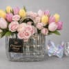 Pink and yellow tulips sweep in a fresh, springlike arc around a