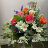 A beautiful mix of roses, alstroemeria, statice, and greens to show how