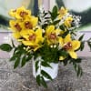 Clusters of bright yellow orchids with speckled centers make a cheerful statement