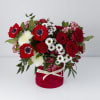 A bold and passionate arrangement designed to captivate. Featuring rich red roses