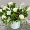 Pure white calla lilies and creamy white roses form a calm, refined
