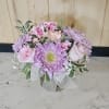 Pastel colors arranged in a clear vase. 
