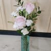 Rose arrangement in a colored vase. A prefect little vase to brighten