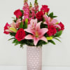 Large size lush mix of pink lilies, red roses, and tall snapdragons