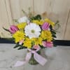 A spring time arrangement arranged in a clear vase. 