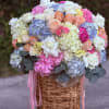 A beautifully designed garden-style arrangement featuring a soft blend of seasonal blooms