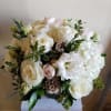 White rose and hydrangea bouquet with pale pink accents